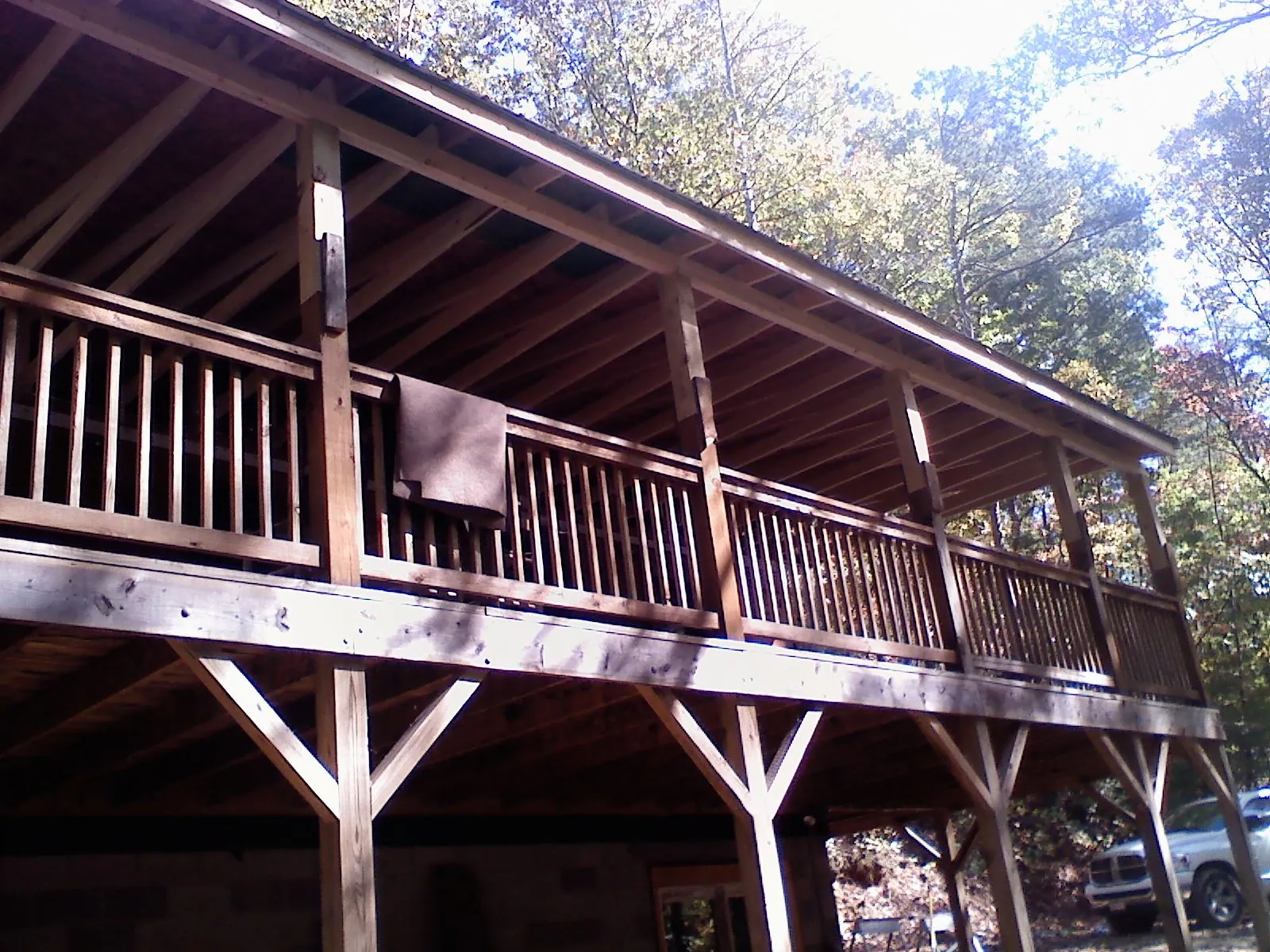 Timber framing under a new elevated porch and deck — Roof Leak Repair in Mansfield Center by Roofing Brothers